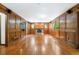 Charming living room showcasing wood paneling, hardwood floors, and abundant natural light at 2717 Hearthstone Cir, Marietta, GA 30062