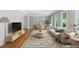Staged living room with hardwood floors, light-colored sofa, area rug, and sun-filled windows at 2717 Hearthstone Cir, Marietta, GA 30062