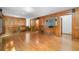 Large living room featuring hardwood floors and wood paneling at 2717 Hearthstone Cir, Marietta, GA 30062