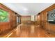Spacious living room featuring hardwood floors, wood paneling, and ample natural light at 2717 Hearthstone Cir, Marietta, GA 30062