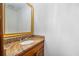 Granite counters and gold-trimmed mirror add a touch of elegance to the powder room at 2717 Hearthstone Cir, Marietta, GA 30062
