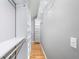 Long walk-in closet offers ample storage with shelves and rods at 2717 Hearthstone Cir, Marietta, GA 30062