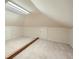 An attic with a painted floor and low storage access points at 7155 Roswell Rd # 58, Atlanta, GA 30328