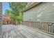 Wood deck with railing and green house siding at 7155 Roswell Rd # 58, Atlanta, GA 30328