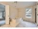 Bathroom featuring a large soaking tub and tile floors at 7155 Roswell Rd # 58, Atlanta, GA 30328