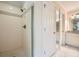 Bathroom featuring a tiled shower with a glass door and a neutral color palette at 7155 Roswell Rd # 58, Atlanta, GA 30328
