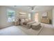 Spacious bedroom showcasing neutral décor, a ceiling fan, and plentiful natural light streaming through the windows at 7155 Roswell Rd # 58, Atlanta, GA 30328