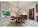 Bright dining area featuring tile flooring, large windows, and elegant furnishings at 7155 Roswell Rd # 58, Atlanta, GA 30328