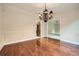 Dining room with hardwood floors, elegant trim and a decorative chandelier at 7155 Roswell Rd # 58, Atlanta, GA 30328
