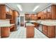 Spacious kitchen with custom wood cabinets, granite countertops, and stainless steel appliances at 7155 Roswell Rd # 58, Atlanta, GA 30328