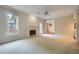Living room with fireplace, neutral carpet and paint color at 7155 Roswell Rd # 58, Atlanta, GA 30328