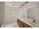 Bright bathroom features tile floors, double sinks, and a shower with tub at 1595 Bakers Glen Dr, Atlanta, GA 30350