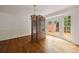 Dining room with hardwood floors, chandelier, and glass doors leading to the deck at 1595 Bakers Glen Dr, Atlanta, GA 30350