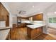 Traditional kitchen with wood cabinets, stainless steel appliances, and a breakfast bar at 1595 Bakers Glen Dr, Atlanta, GA 30350