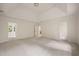 Spacious main bedroom with tray ceiling, neutral walls, and carpet flooring at 1595 Bakers Glen Dr, Atlanta, GA 30350