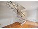 Bright foyer with wooden staircase and trim, and detailed wall paneling, offering a classic and elegant entrance at 1595 Bakers Glen Dr, Atlanta, GA 30350