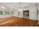 Sunroom with brick flooring, multiple windows, and a chandelier for cozy relaxation at 1595 Bakers Glen Dr, Atlanta, GA 30350