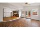 Sunroom featuring brick flooring, ample windows, and open access to the kitchen at 1595 Bakers Glen Dr, Atlanta, GA 30350