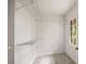 Walk-in closet with carpeted floor, wire shelves, and a window for natural light at 1595 Bakers Glen Dr, Atlanta, GA 30350