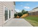 Backyard featuring a concrete patio and a wood fence at 230 Collins View Ct, Lawrenceville, GA 30043