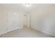 Bright bedroom features neutral walls, plush carpeting, and a spacious closet at 230 Collins View Ct, Lawrenceville, GA 30043
