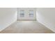 Expansive bedroom with bright natural light, neutral walls, and carpeting at 230 Collins View Ct, Lawrenceville, GA 30043