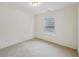 This cozy bedroom is bright with natural light, featuring a large window at 230 Collins View Ct, Lawrenceville, GA 30043