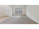 Inviting living room with neutral tones, carpeted floors, and great natural light at 230 Collins View Ct, Lawrenceville, GA 30043