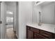 Well-lit bathroom with modern fixtures and a vanity with dark wood cabinets at 2537 Sori Dr, Buford, GA 30519