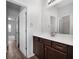 Bathroom featuring a vanity with dark wood cabinets, a mirror, and modern fixtures at 2537 Sori Dr, Buford, GA 30519