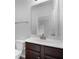 Bathroom featuring a vanity with dark wood cabinets, a mirror, a toilet, and modern fixtures at 2537 Sori Dr, Buford, GA 30519