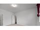 A bedroom featuring carpet flooring, a window with curtains, and a door to the bathroom at 2537 Sori Dr, Buford, GA 30519