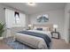 The main bedroom has carpet floors, a large window, a double bed, and matching nightstands at 2537 Sori Dr, Buford, GA 30519