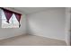 A room with carpet flooring, a window with curtains and blinds, and a door to the bathroom at 2537 Sori Dr, Buford, GA 30519