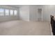 This bonus room has carpet and large windows to let in the natural light at 2537 Sori Dr, Buford, GA 30519