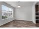 Empty dining room featuring beautiful laminate flooring and a bright window at 2537 Sori Dr, Buford, GA 30519