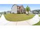 A spacious lawn surrounds this traditional brick home, offering great curb appeal at 2537 Sori Dr, Buford, GA 30519