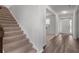 Bright foyer features hardwood floors and staircase leading to the upper level at 2537 Sori Dr, Buford, GA 30519