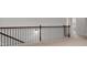 This open hallway features iron railing and carpet at 2537 Sori Dr, Buford, GA 30519