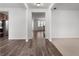 Open-concept hallway featuring sleek hardwood flooring and modern, neutral paint at 2537 Sori Dr, Buford, GA 30519