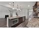 Bright kitchen features a granite island, fireplace in the living area, and stainless appliances at 2537 Sori Dr, Buford, GA 30519