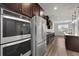 Modern kitchen showcases stainless steel appliances and dark wood cabinetry at 2537 Sori Dr, Buford, GA 30519