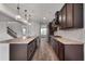 Spacious kitchen features a large island with granite countertops and stainless steel appliances at 2537 Sori Dr, Buford, GA 30519