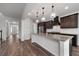 Open concept kitchen boasts granite countertops and stainless steel appliances at 2537 Sori Dr, Buford, GA 30519