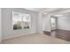 Bright living space with large window, neutral paint and flowing into dining area at 2537 Sori Dr, Buford, GA 30519