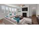 Bright living room features a cozy fireplace, ceiling fan, and lots of natural light at 2537 Sori Dr, Buford, GA 30519