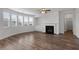 View of the living room featuring wood floors, a fireplace, and lots of natural light at 2537 Sori Dr, Buford, GA 30519