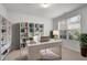 Bright, staged office space with a large window, stylish desk, and built-in bookshelves at 2537 Sori Dr, Buford, GA 30519