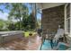 Outdoor deck with hot tub, seating and stone accents is great for relaxing and entertaining at 525 Arbor Creek Ct, Roswell, GA 30076