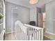 Bedroom with white crib, and soothing decor provides a calm environment at 525 Arbor Creek Ct, Roswell, GA 30076